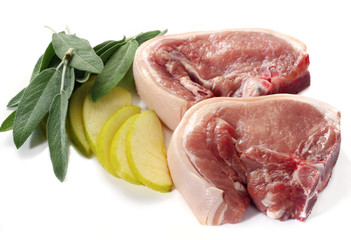 Pork Chops ready for cooking, with sage leaves and apple 