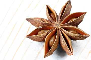 A single star anise, on weathered timber 