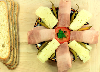 Balkan Style Appetiser served over pottery plate.