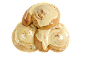 A plate full of fresh sweet rolls ready to be eaten.