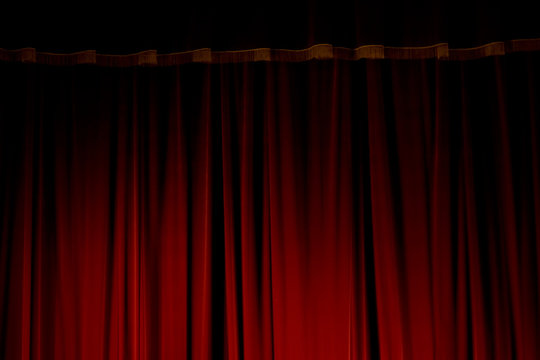 Red velvet curtains of the theater stage