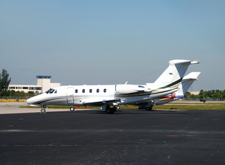 Business jet parked on the airport tarmac