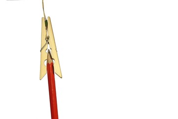 a clothespin and pensil