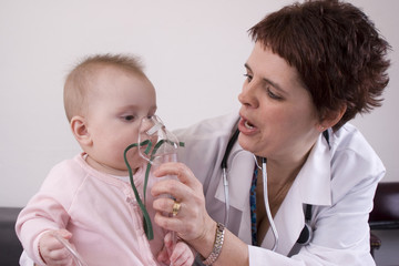 Seven month old baby getting a nebulizer treatment.