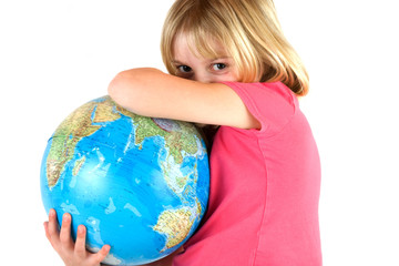 Young girl protecting a globe symbolising protecting the earth