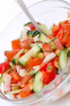 Tasty dietary salad from tomatoes, cucumbers and radish