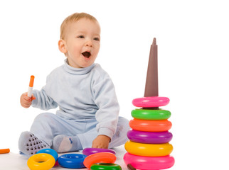 small boy with toys on white background