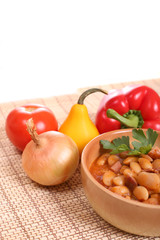 Delicious beans with sausages and tomatoes.