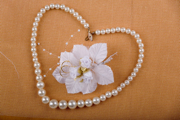 Pearl heart with flower and wedding rings