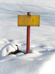 old yellow rusty tablet on white snow background