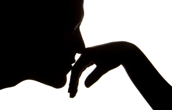 man kissing womens hand  silhouette