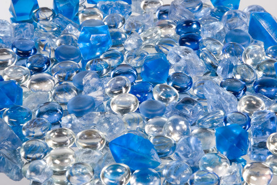 Blue crystals and glass drops on a white background