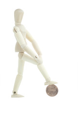 Manikin standing on one euro coin