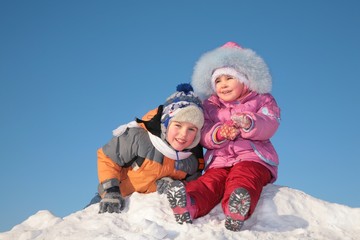 two children on snow hill
