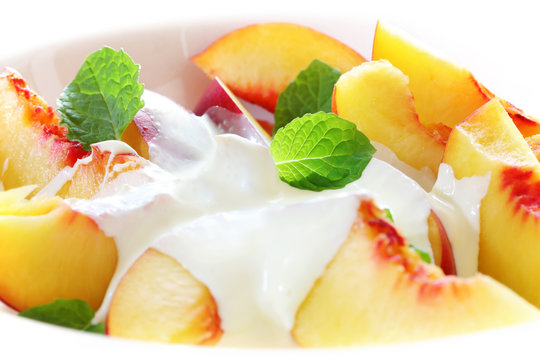 Fresh Peaches And Minted Cream.  With Mint Leaves.