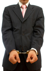 businessman with handcuffs for business crime concept