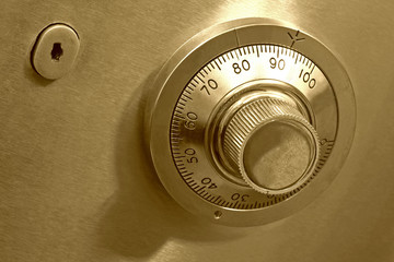 Combination safe lock, in golden duotone. - obrazy, fototapety, plakaty