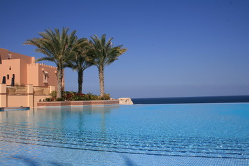 Beautiful blue fresh infinity pool in a villa