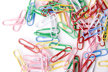 a lot of paper clips isolated on white