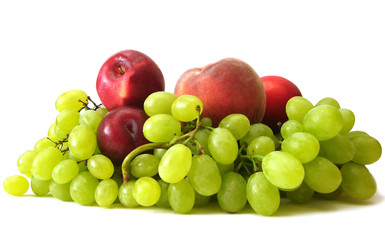 many fruits on white background (peach, grapes, plume and apple)
