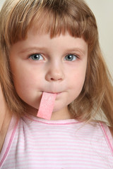 child in rose with chewing gum