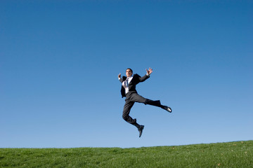 Fototapeta na wymiar Businessman jumping in the air