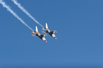 F-16 Thunderbird jets leaving smoke trails