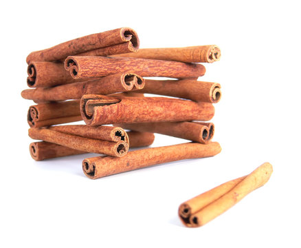 A house made from cinnamon sticks on a white background