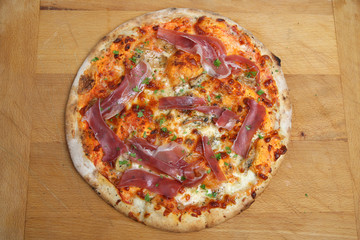 Pizza with porcini mushrooms and proscuitto ham