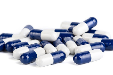 blue and white capsule pills isolated