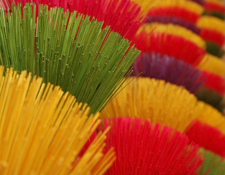 colorfull inscents in red, yellow, green and purple