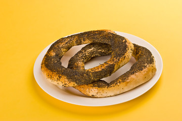 two tasty boublik on the yellow background