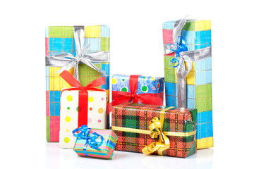 Assortment of gift boxes, reflected on white background