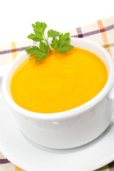 Carrots puree with parsley over squared mat. Shallow DOF