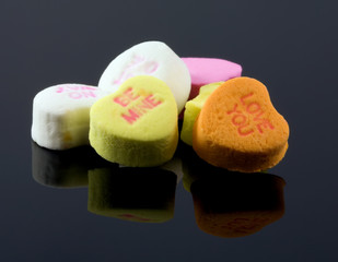 Valentine candy hearts on black