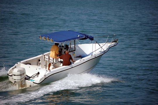 Sport Fishing Boat with Blue Canvas Canopy