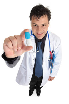 A friendly doctor or pharmicist is holding medication