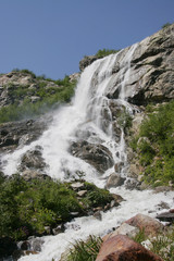 A large waterfall is in mountains