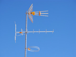 TV and radio fm home reception aerial antennas on roof
