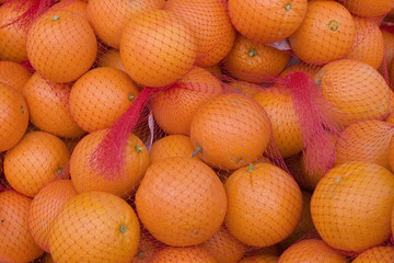 Oranges in red net bags