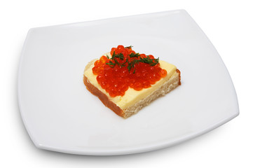 Sandwich with red caviar on a white plate