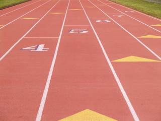 numbered lanes on an outdoor running track