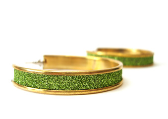 Green ear-rings isolated on white background