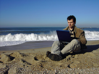 businessman working on the beach