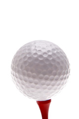 Golf ball and tee over white