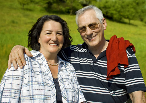 attractive married mature couple enjoying the nature.