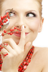 portrait of lovely blond with red ashberry and cotton