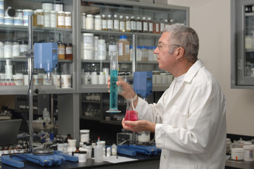 Senior chemist formulating in a laboratory