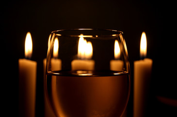 Wine glass with white candlelights in the background. - 6126743