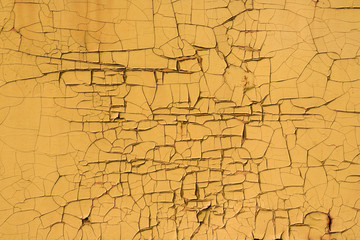 a photo of a texture - a very old yellow painted wall